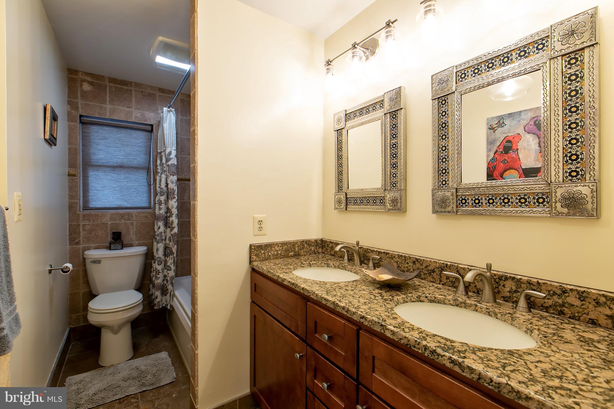 13015 Bottom Road Hydes, MD 21082 - Photo 13 of 30 a bathroom with a granite countertop sink and a mirror