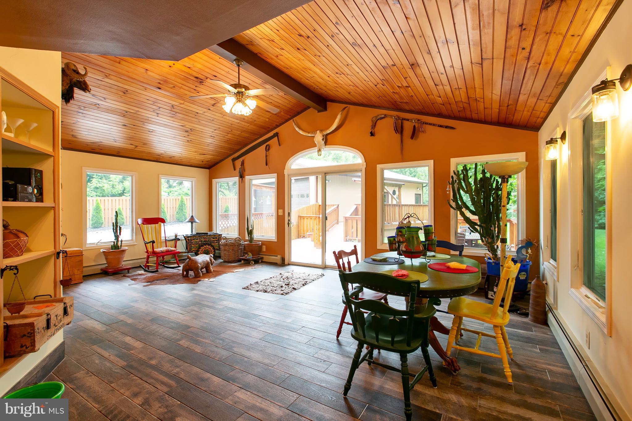 13015 Bottom Road Hydes, MD 21082 - Photo 7 of 30 a dining room with furniture large windows and wooden floor