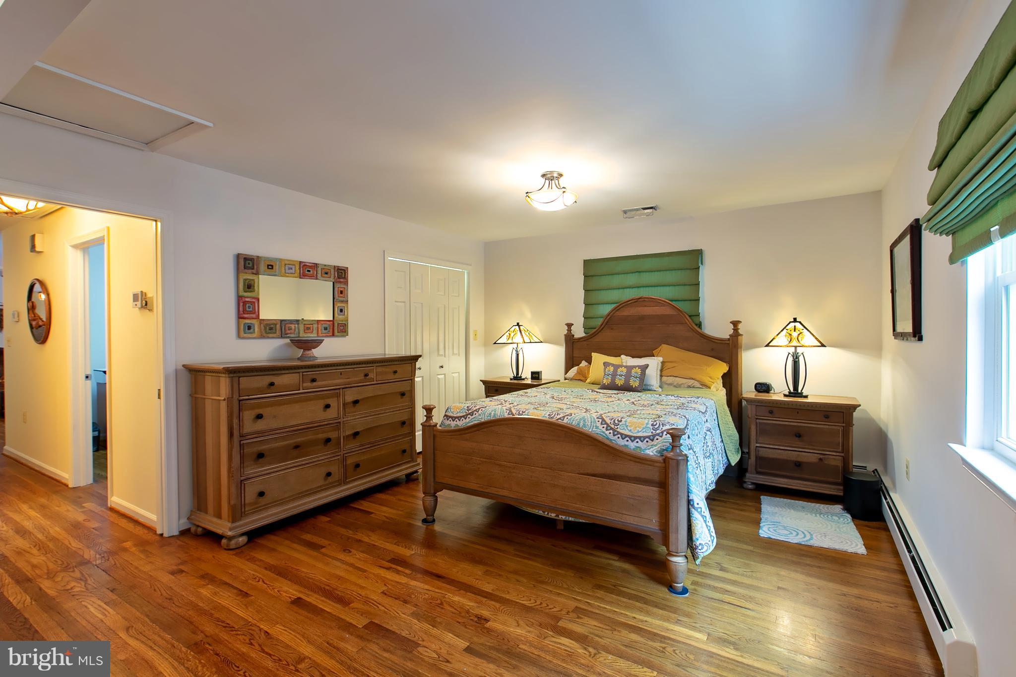 13015 Bottom Road Hydes, MD 21082 - Photo 8 of 30 a bedroom with a bed and a dresser