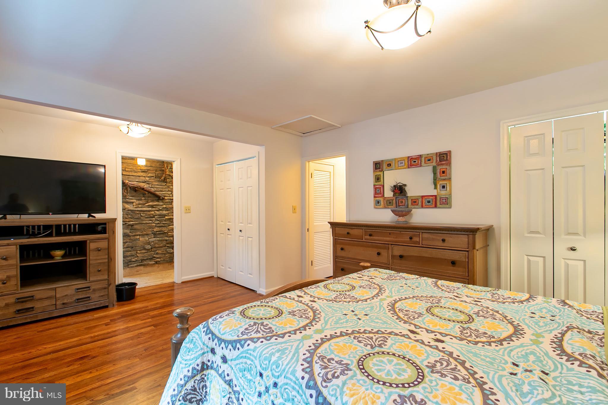 13015 Bottom Road Hydes, MD 21082 - Photo 9 of 30 a bedroom with a bed and wooden floor