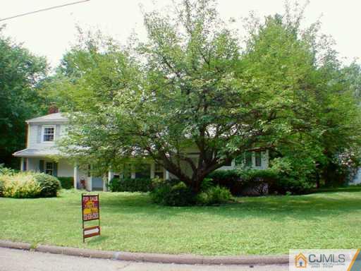 178 Colonia Road Colonia, NJ 07067 - Photo 2 of 2 a front view of a house with a yard