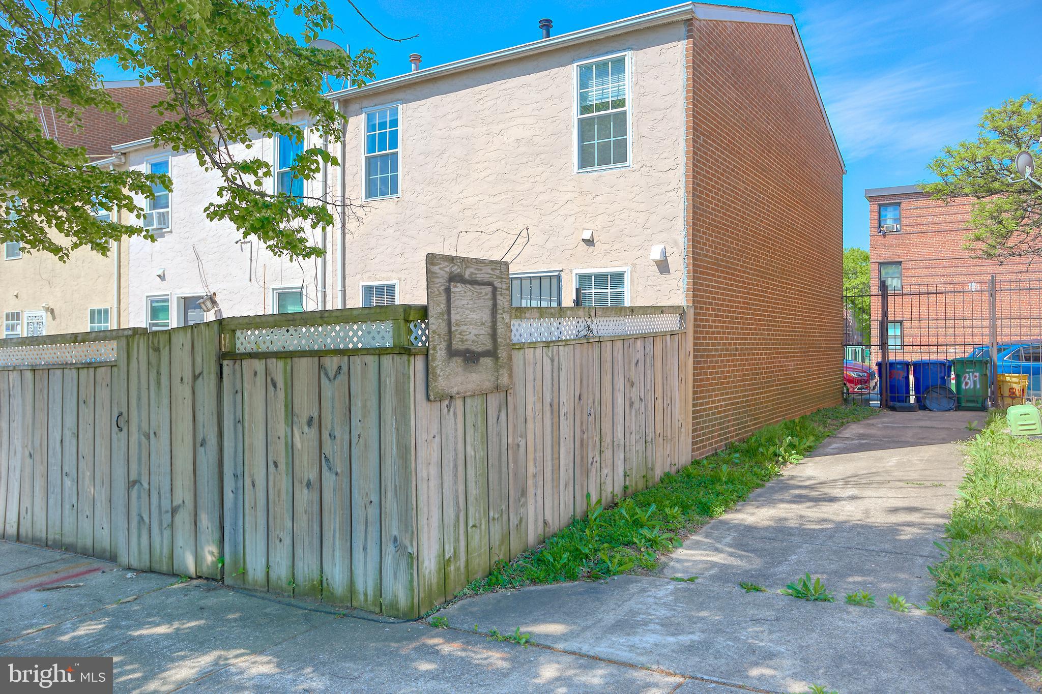819 Aisquith Street Baltimore, MD 21202 - Photo 16 of 26 a view of a house with a backyard space