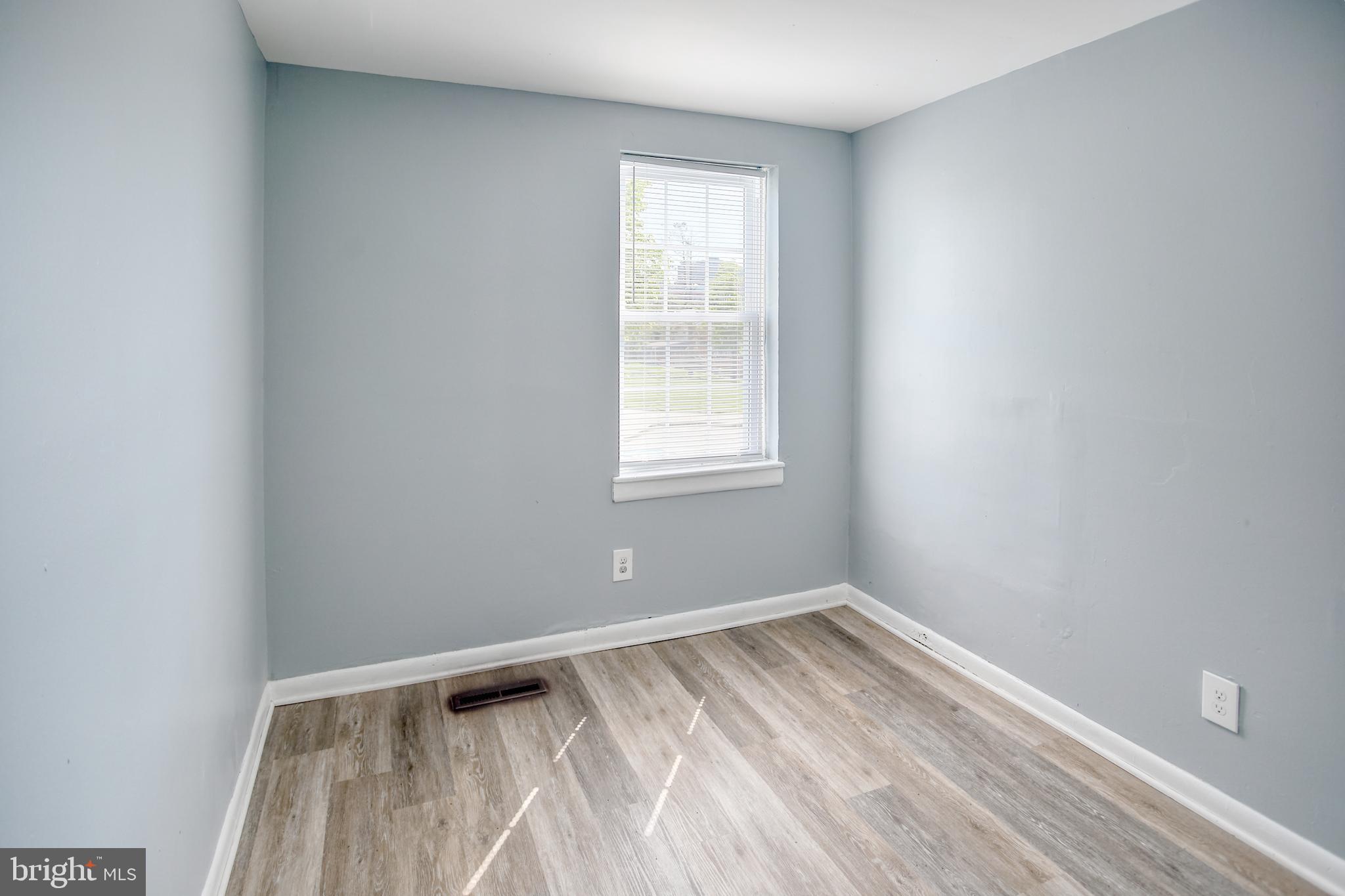 819 Aisquith Street Baltimore, MD 21202 - Photo 23 of 26 a view of an empty room with a window