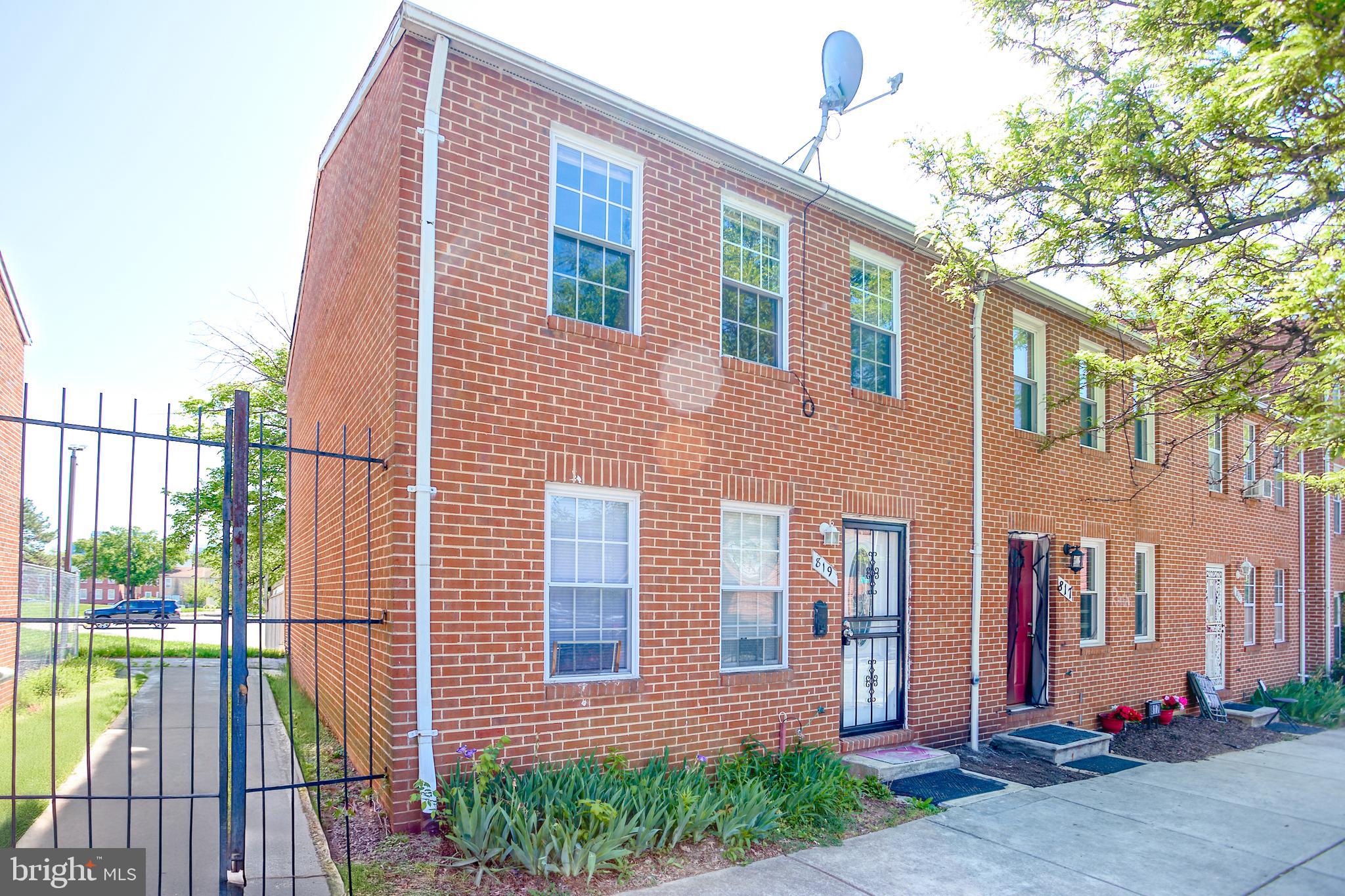 819 Aisquith Street Baltimore, MD 21202 - Photo 3 of 26 a front view of a house with a garden