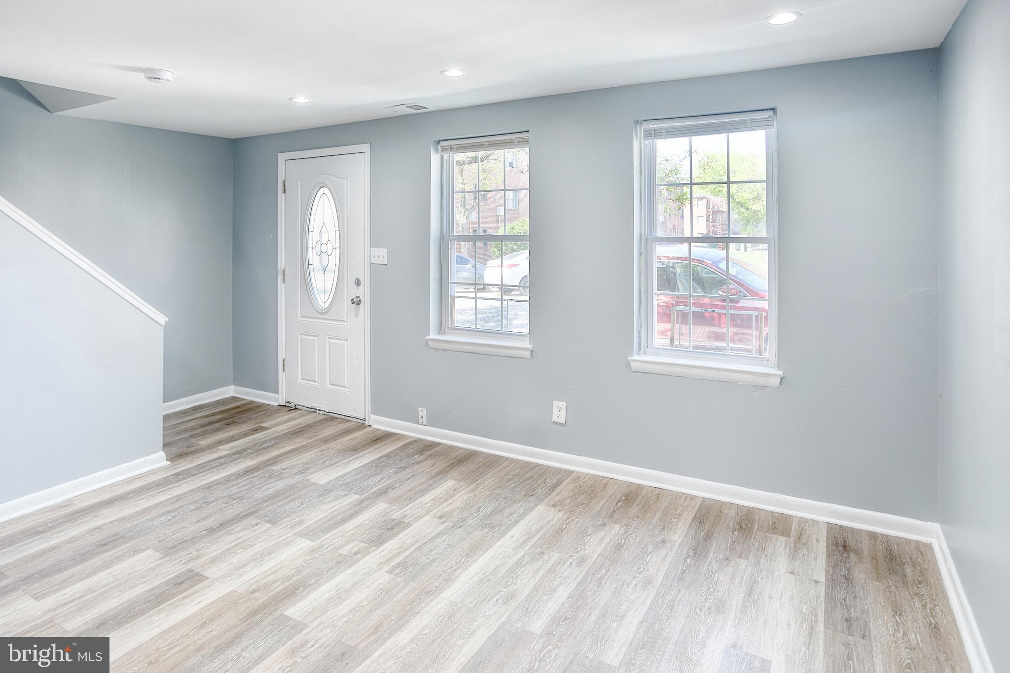 819 Aisquith Street Baltimore, MD 21202 - Photo 5 of 26 an empty room with windows