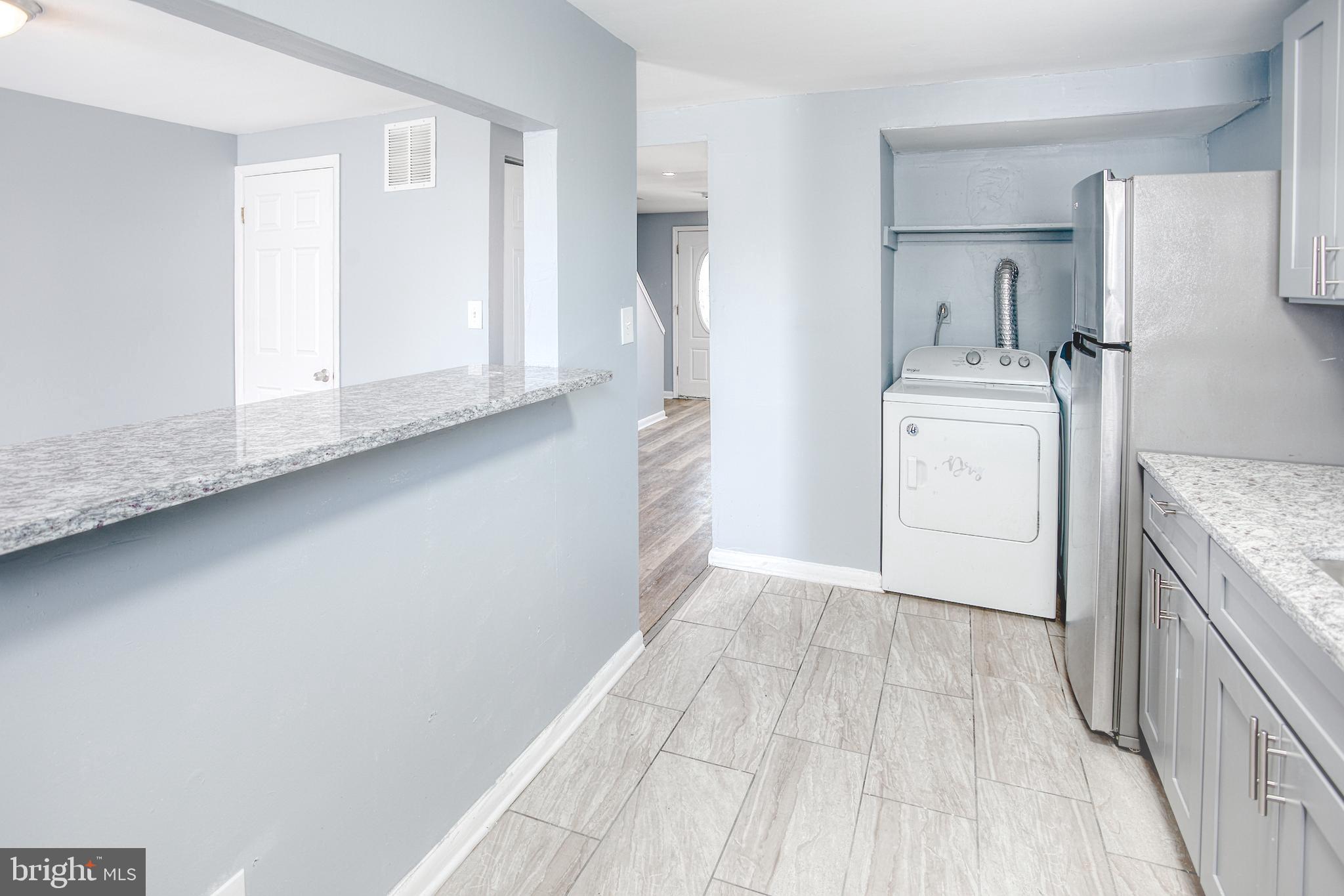 819 Aisquith Street Baltimore, MD 21202 - Photo 10 of 26 a view of a storage & utility room with a sink