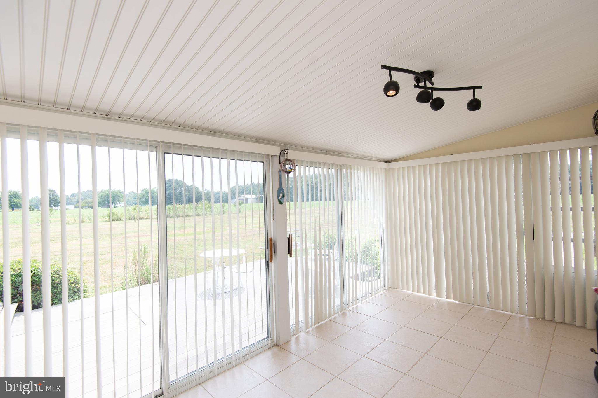 6046 Todds Point Road Cambridge, MD 21613 - Photo 46 of 94 Sun Room Opens to Side Deck