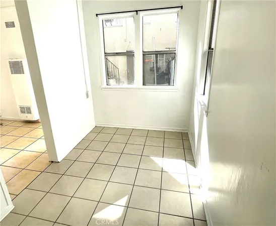 a view of an empty room with windows