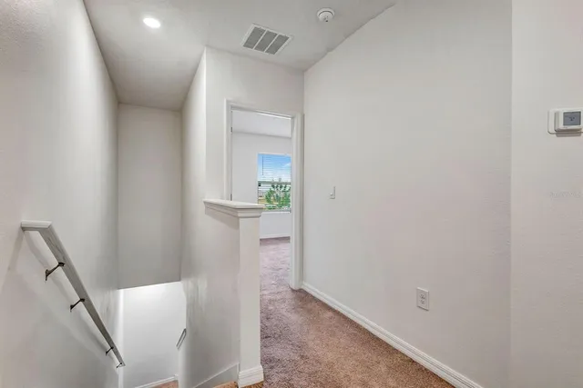 a view of a room that has a window in it