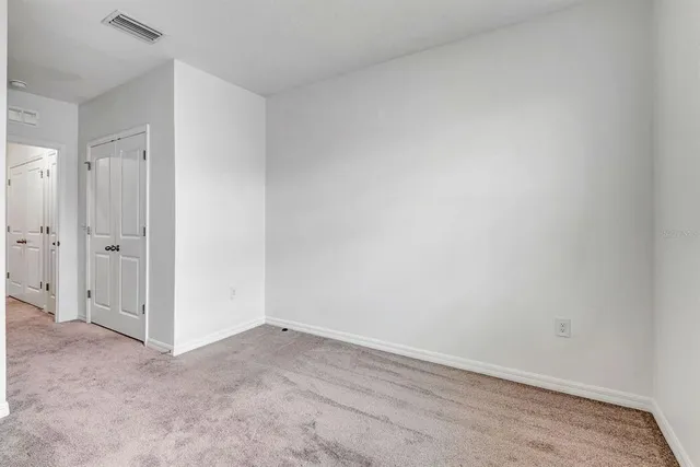 a view of a white house with a large window