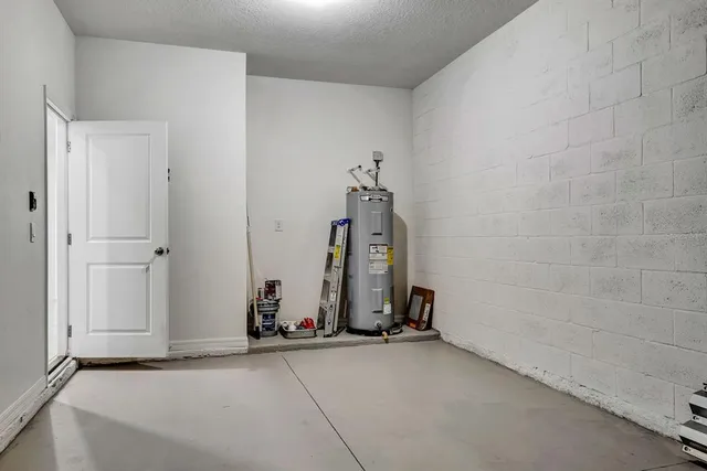 an aerial view of residential houses with outdoor space and lake view