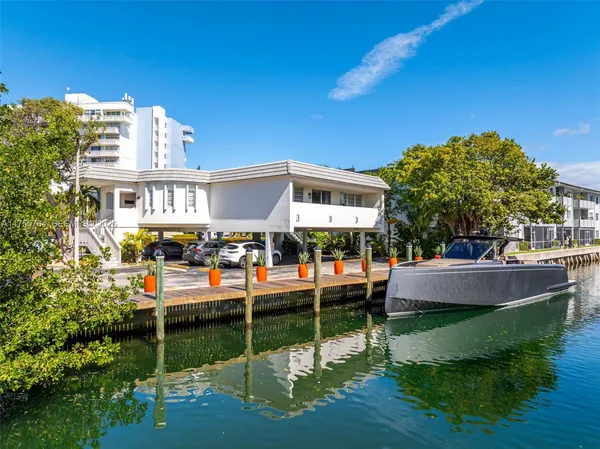 a view of house with outdoor space and swimming pool