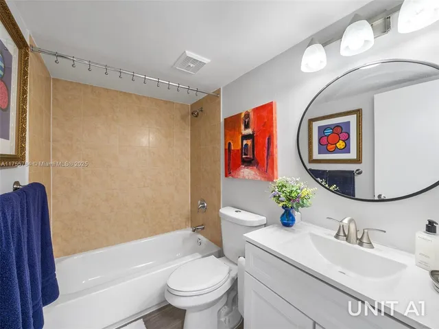 a bedroom with a bed table closet and a window