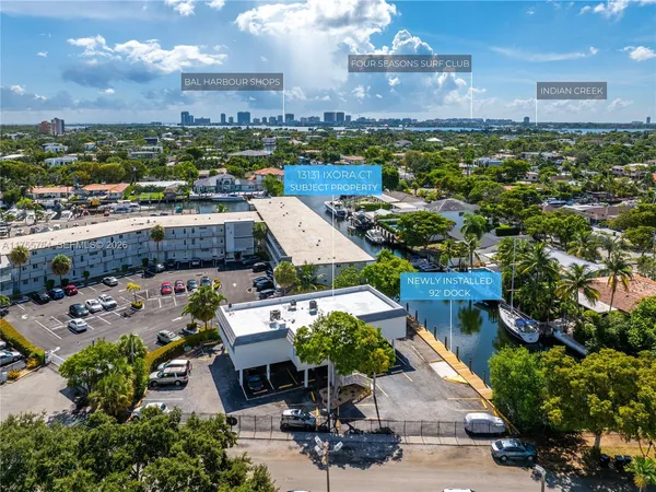 an aerial view of multiple houses with yard