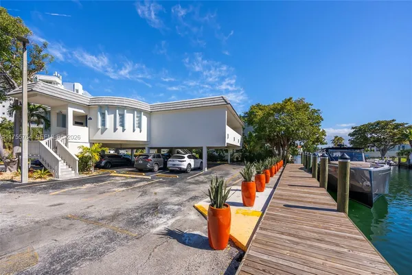 a view of a house with wooden deck