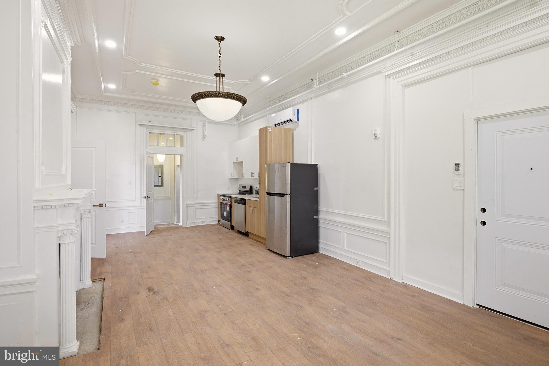 6012 Ridge Avenue, Unit 2 Philadelphia, PA 19128 - Photo 2 of 15 a view of a kitchen with refrigerator and cabinets