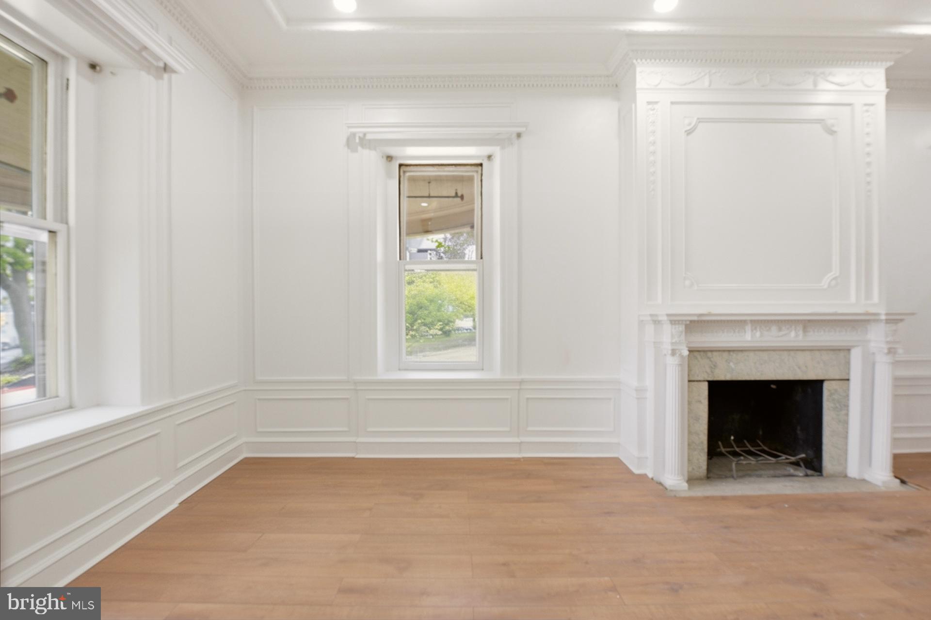 6012 Ridge Avenue, Unit 2 Philadelphia, PA 19128 - Photo 3 of 15 a view of empty room with front door and wooden floor