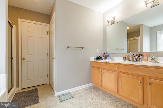 a white bath tub sitting next to a window