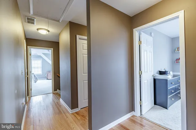 a bathroom with a sink a toilet and a window