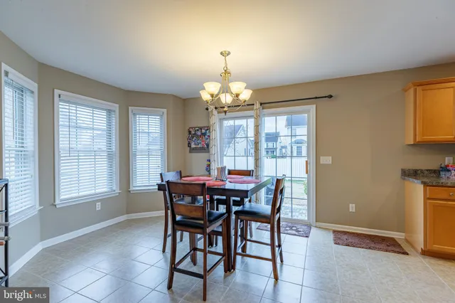 a view of a dining room with furniture and window