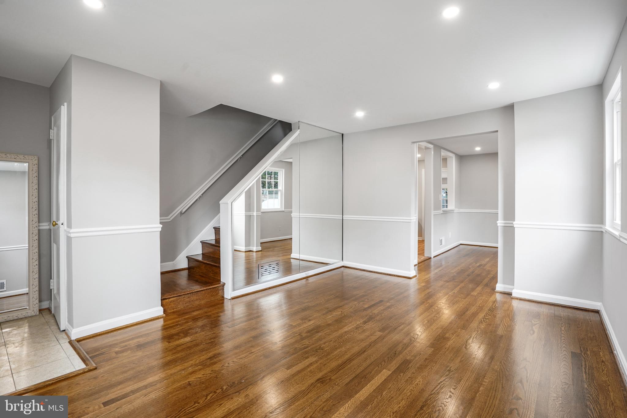 3202 13th Road South Arlington, VA 22204 - Photo 1 of 32 a view of an empty room with wooden floor and a window
