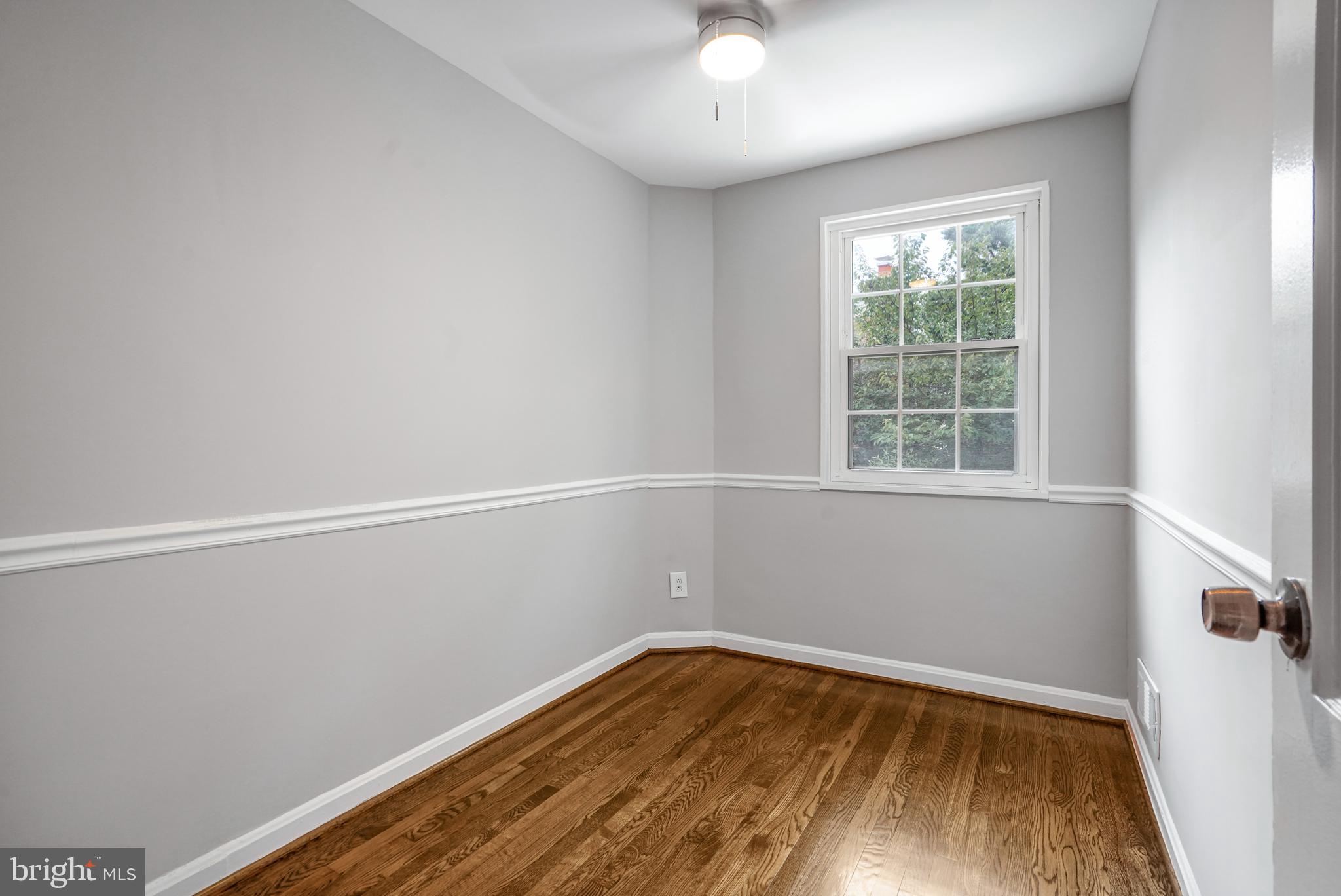3202 13th Road South Arlington, VA 22204 - Photo 18 of 32 wooden floor in an empty room with a window