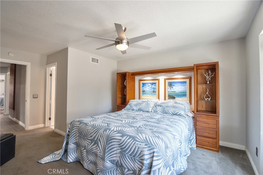 1986 White Rabbit Trail Upland, CA 91784 - Photo 15 of 50 Primary Bedroom- door on right hand side leads to the master en suite restroom. Door on the left hand side leads to the hallway