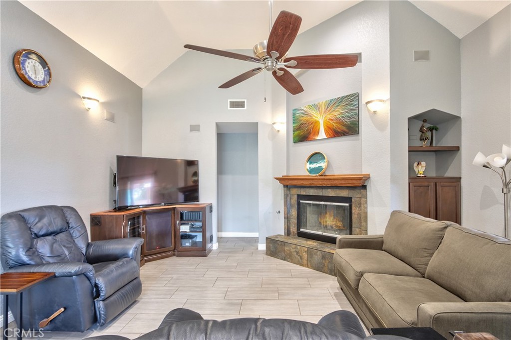 1986 White Rabbit Trail Upland, CA 91784 - Photo 4 of 50 Living room- upon entering the front door. Door next to the fireplace leads to the bedrooms, bathrooms, laundry room and an exterior door.