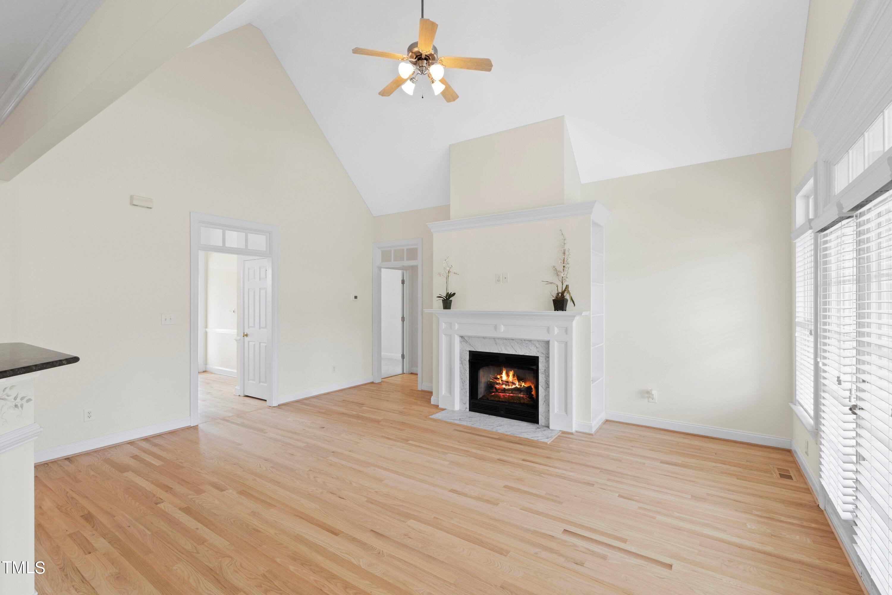 1004 Pasture View Lane Raleigh, NC 27603 - Photo 11 of 48 Another view of the family room looking at the entry to the foyer. Two of the bedrooms are on the side of the house behind the fireplace.