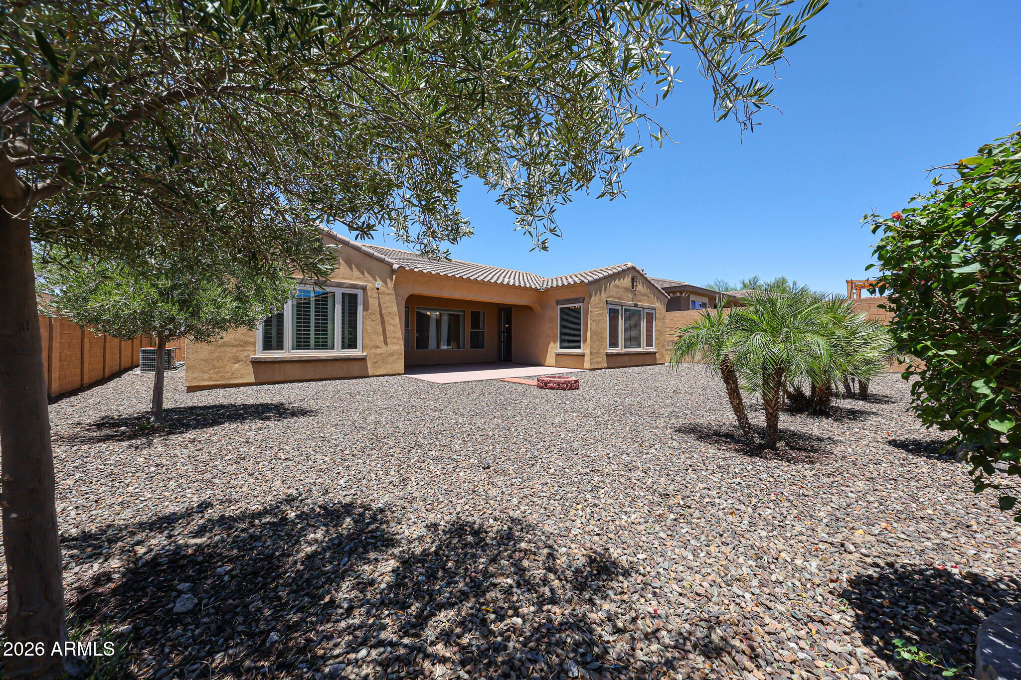18175 West Narramore Road Goodyear, AZ 85338 - Photo 38 of 72 a front view of a house with garden