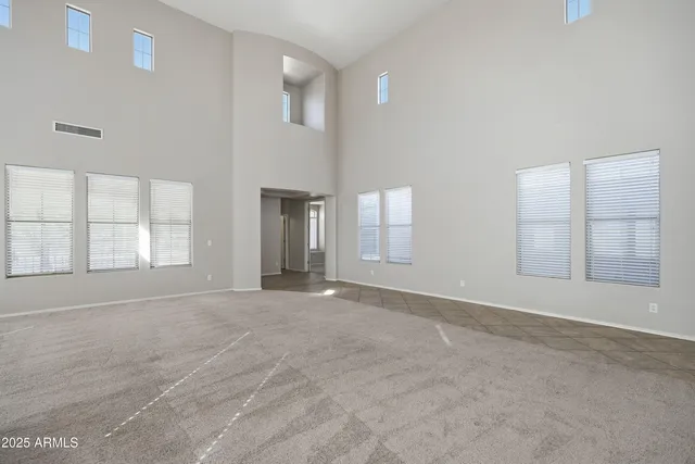 a large kitchen with kitchen island a sink stainless steel appliances and cabinets