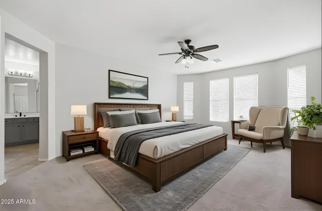 a bathroom with a tub a sink double vanity and a mirror