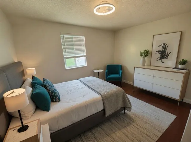 a bedroom with a bed and window