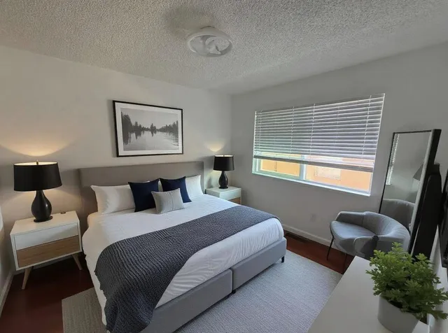 a bedroom with a bed and a window