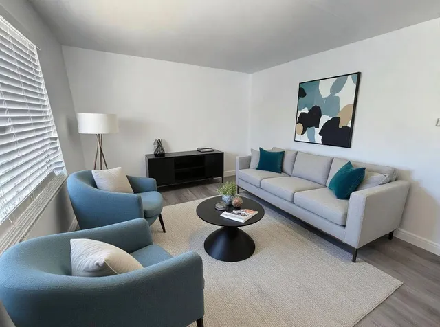 a living room with furniture and a couch