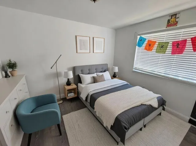 a bedroom with a bed and a couch