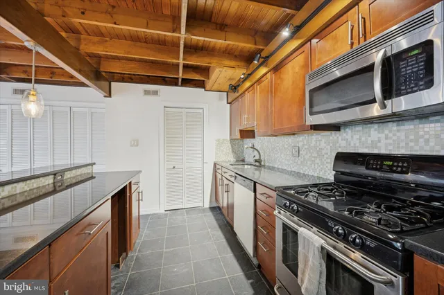 a kitchen with a stove and a microwave
