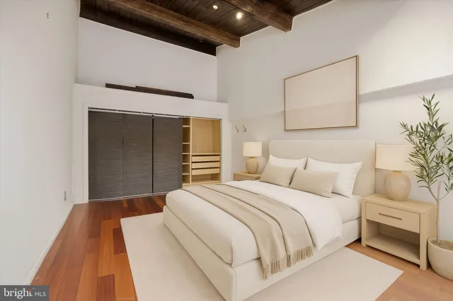 a bedroom with a bed and a couch