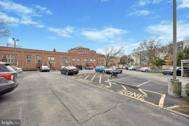 a view of a city street with cars