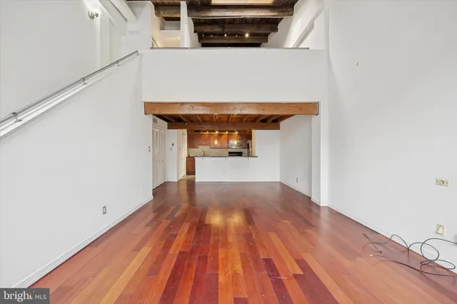 a view of a living room with wooden floor