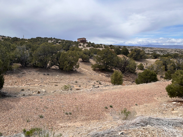 19075 West Honesty Cove Duchesne, UT 84021 - Photo 38 of 44 Hilltop property featuring a multi-story residence with a brown exterior