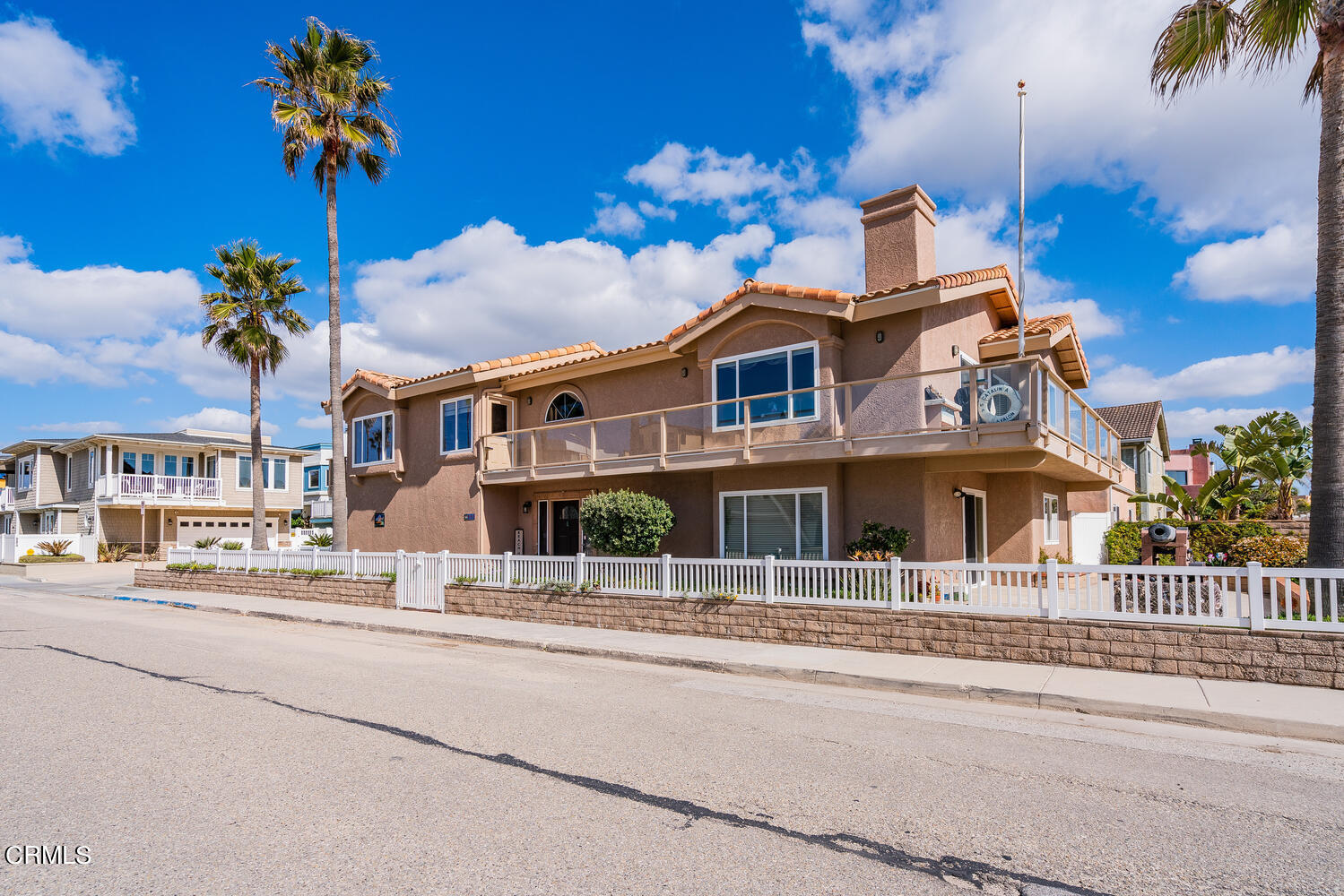 840 Mandalay Beach Road Oxnard, CA 93035 - Photo 2 of 39 a front view of a house with a fountain