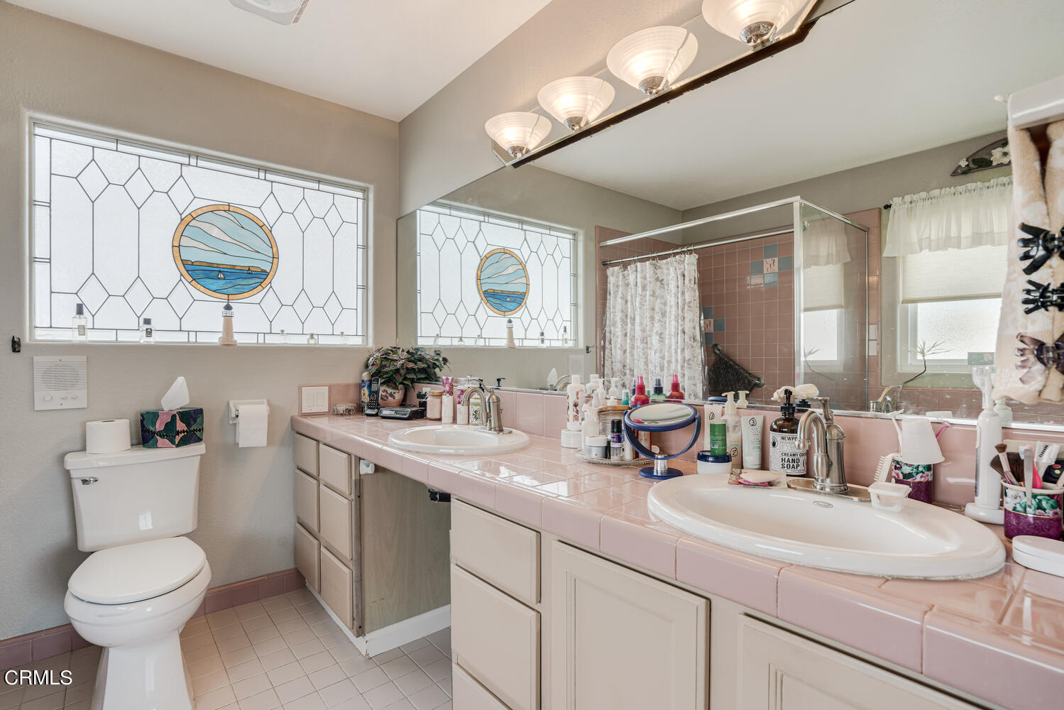 840 Mandalay Beach Road Oxnard, CA 93035 - Photo 23 of 39 a bathroom with a toilet sink and mirror
