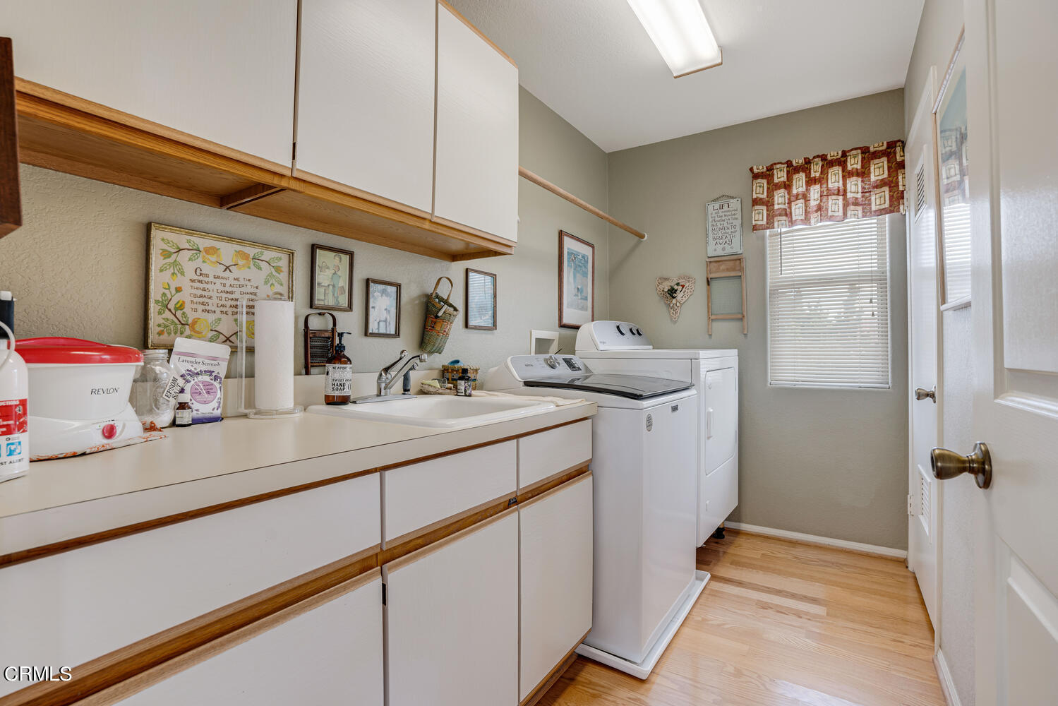 840 Mandalay Beach Road Oxnard, CA 93035 - Photo 26 of 39 a utility room with cabinets washer and dryer