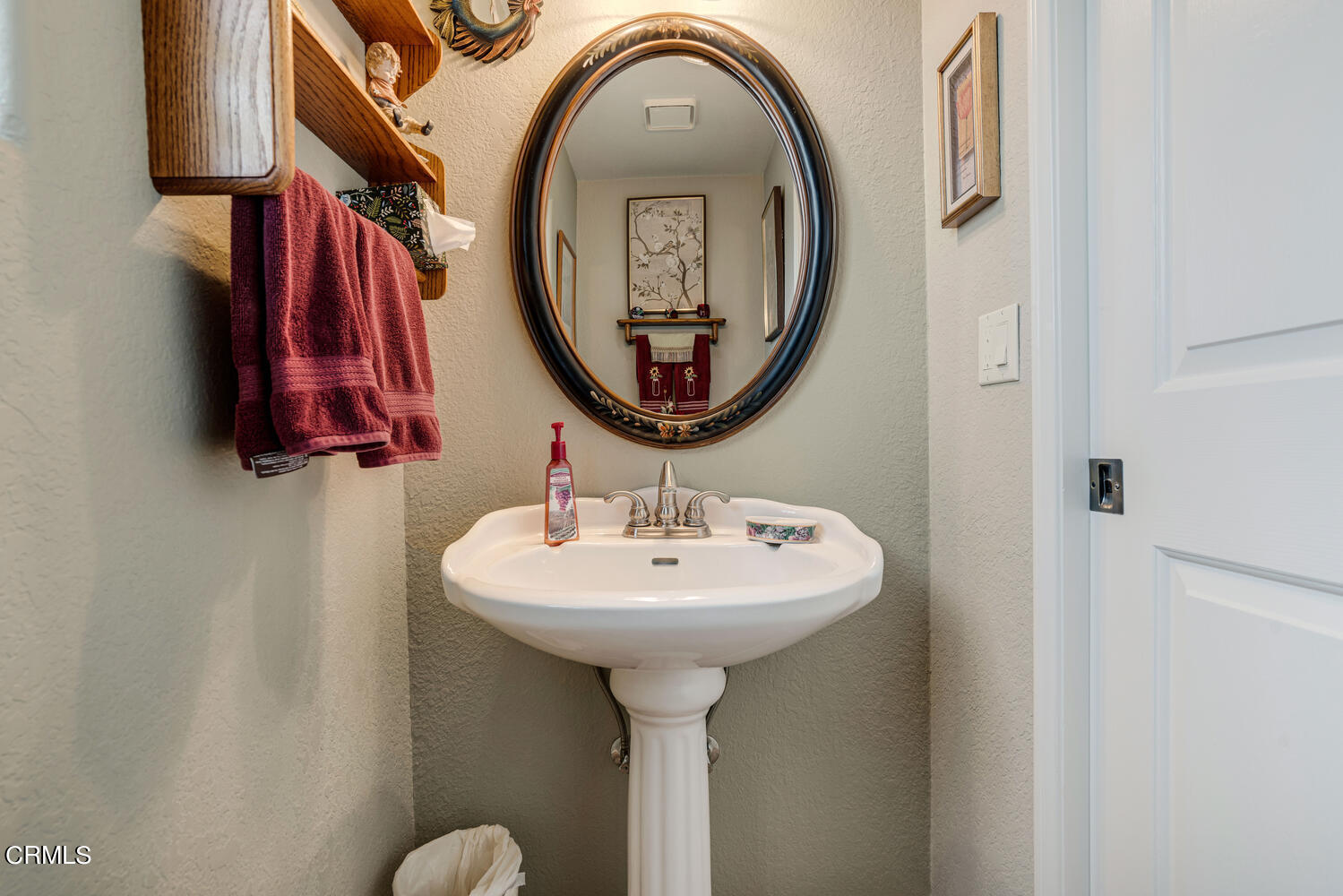 840 Mandalay Beach Road Oxnard, CA 93035 - Photo 27 of 39 a bathroom with a sink and a mirror