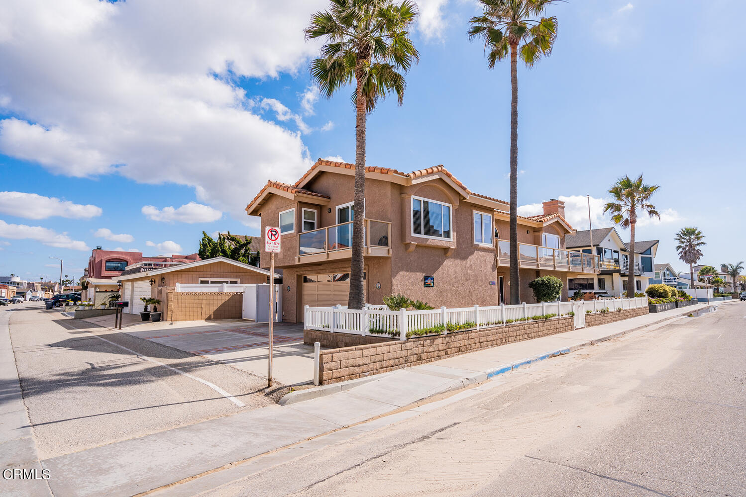 840 Mandalay Beach Road Oxnard, CA 93035 - Photo 32 of 39 a front view of a house with a garden and tree