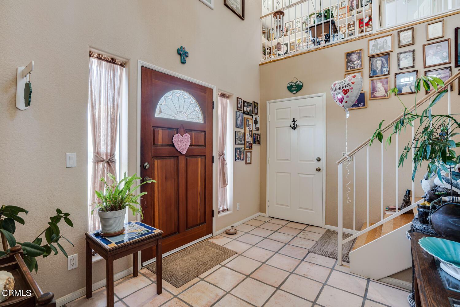 840 Mandalay Beach Road Oxnard, CA 93035 - Photo 7 of 39 a view of a hallway with furniture and a potted plant
