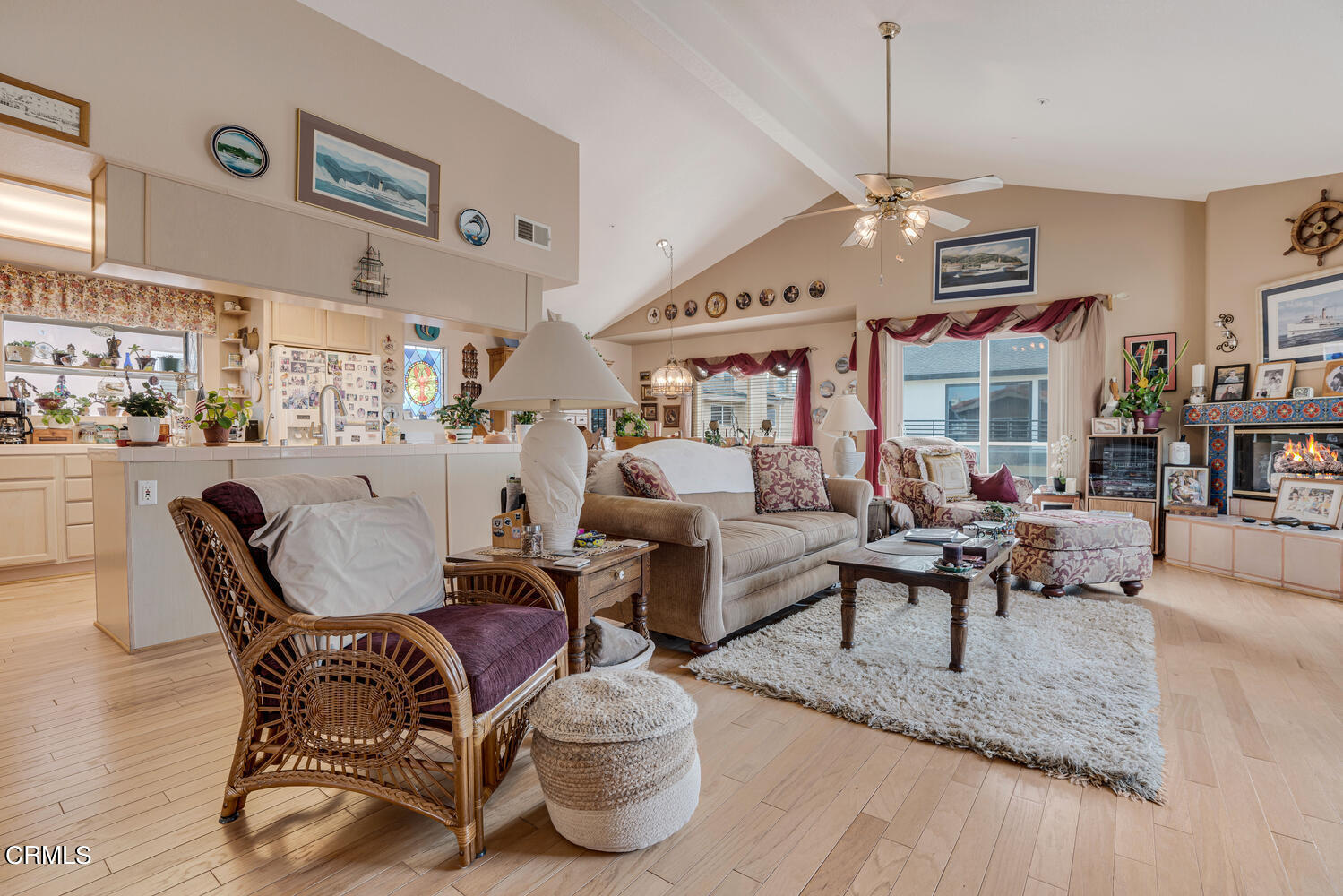 840 Mandalay Beach Road Oxnard, CA 93035 - Photo 8 of 39 a living room with furniture kitchen view and a chandelier