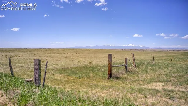 a view of an ocean beach and a yard