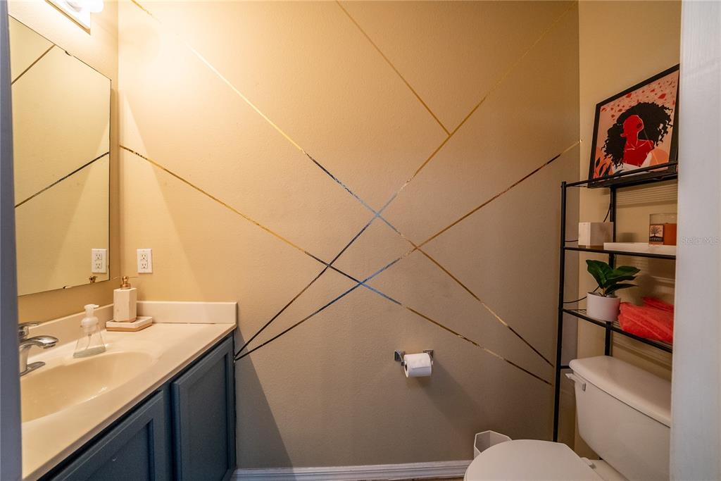 5306 Southwest 115th Street Road Ocala, FL 34476 - Photo 24 of 56 a bathroom with a sink a toilet and shower